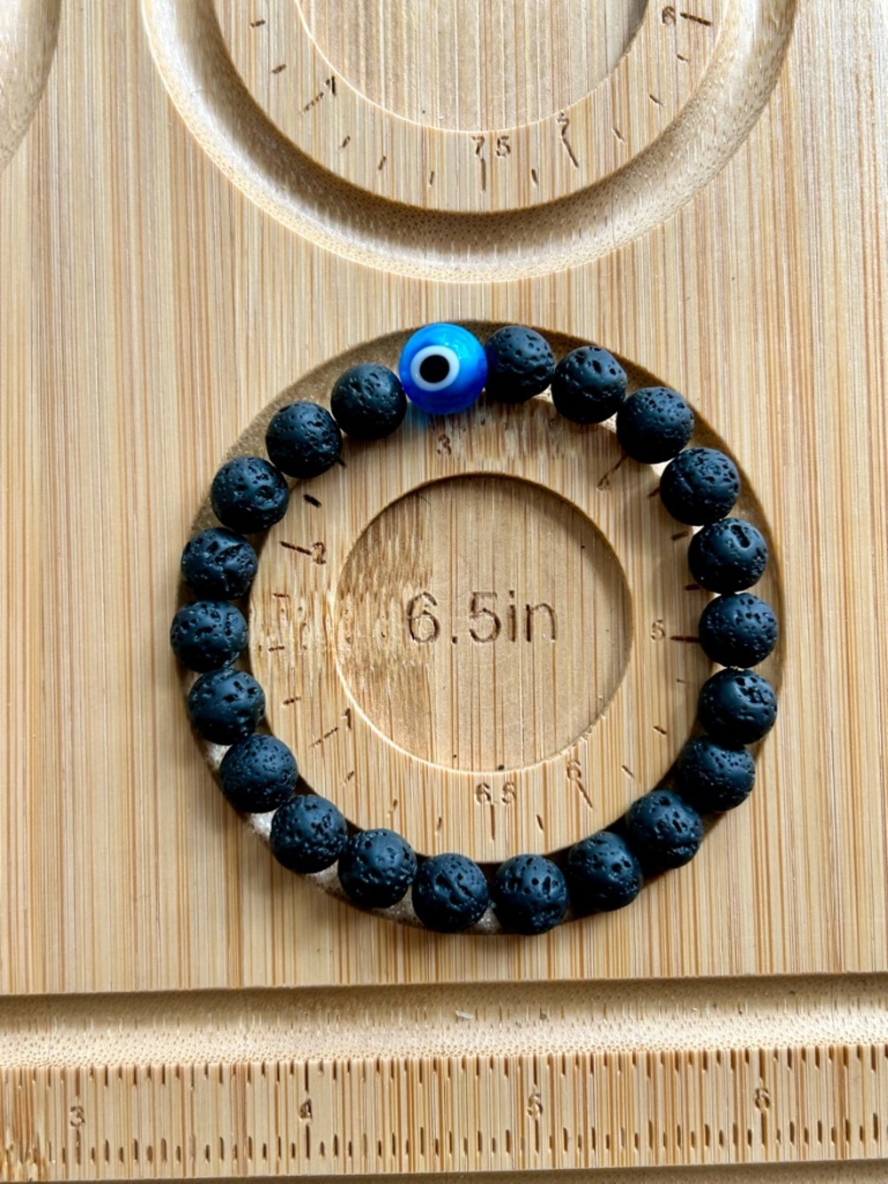 Black Lava Bead Bracelet with Blue Evil Eye